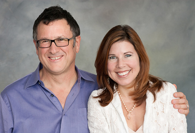 image of a couple standing closely and smiling